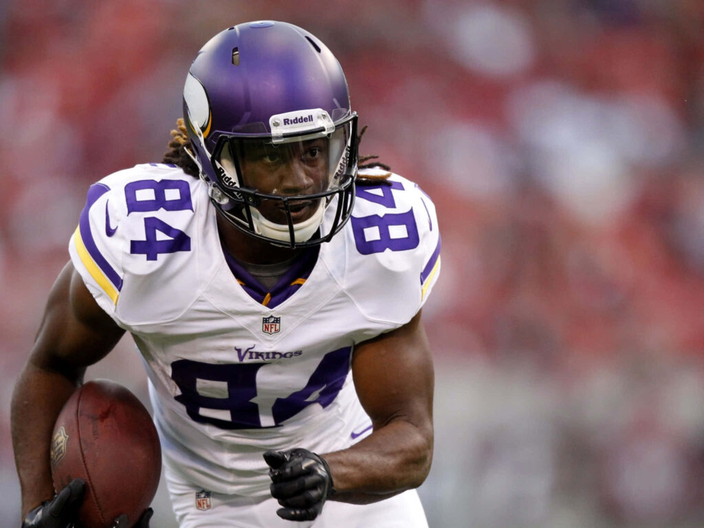 Cordarrelle Patterson Vikings NFL game action in purple white uniform running with focus Wallpaper