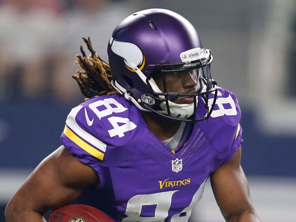 Cordarrelle Patterson Vikings number 84 intense football action vibrant purple gold jersey Wallpaper