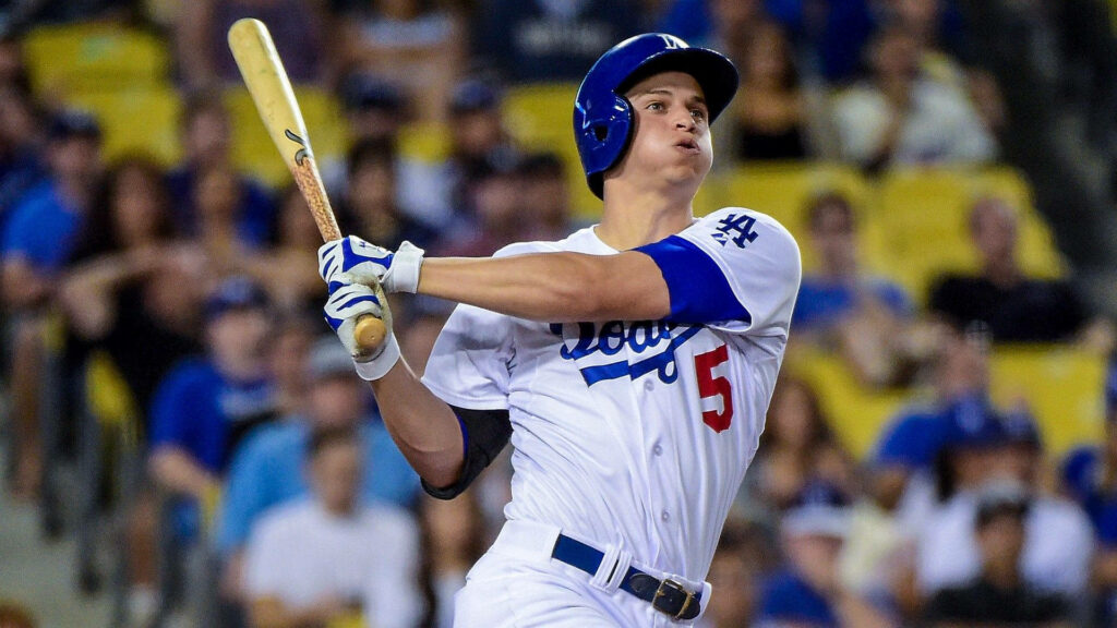 Corey Seager Dodgers mid-swing in stadium vibrant blue jersey action baseball wallpaper background