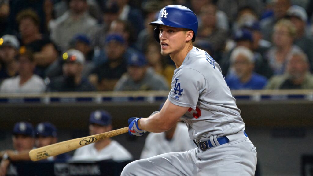 Corey Seager mid-swing in Los Angeles Dodgers uniform powerful focused baseball action wallpaper