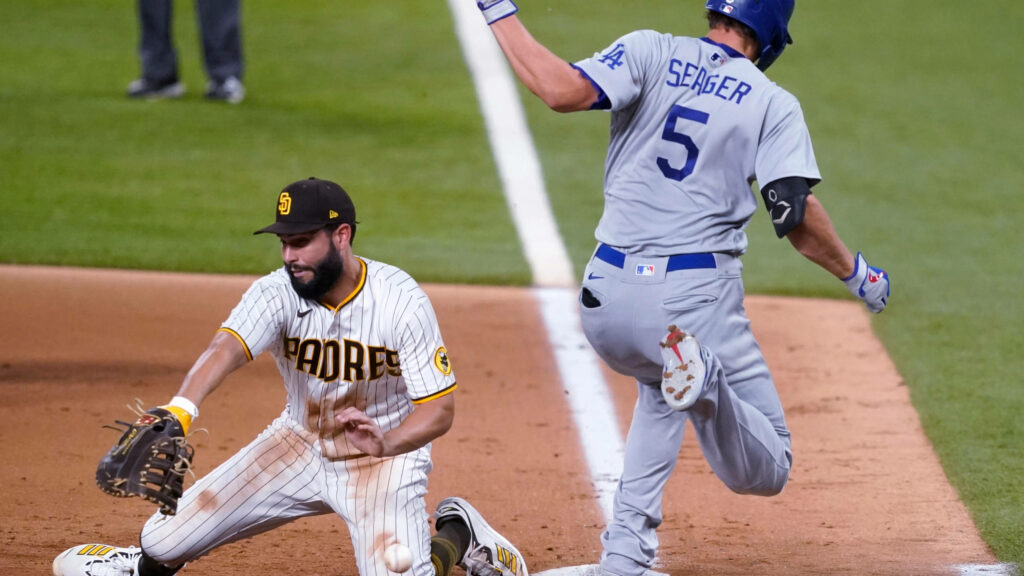 Corey Seager Dodgers sliding into base as Eric Hosmer Padres fields ball in MLB game action Wallpaper