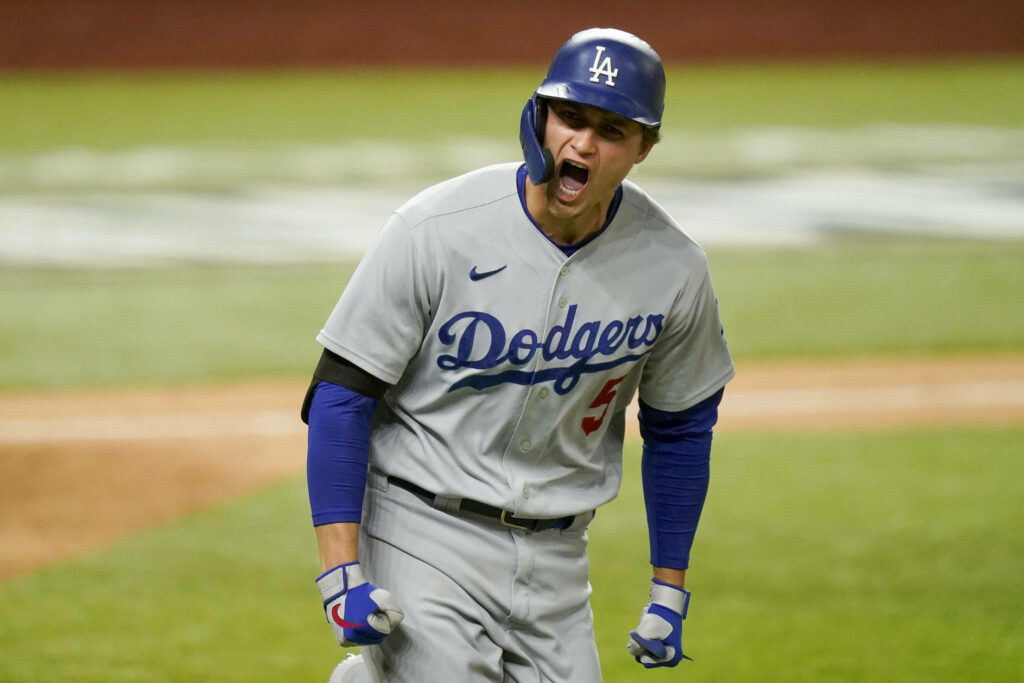 Corey Seager cheering on Dodgers field vivid blue gray colors energetic baseball spirit wallpaper