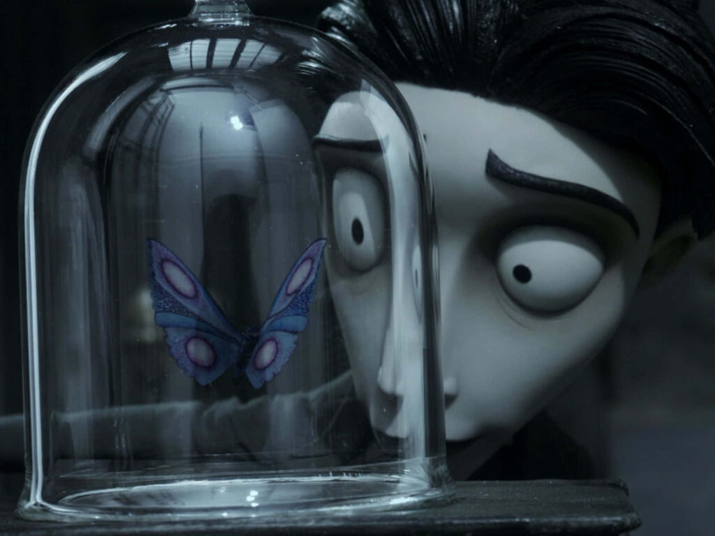 Victor Van Dort gazing at blue butterfly under glass dome in gothic Corpse Bride stop-motion scene Wallpaper