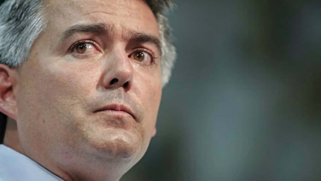 Close-up portrait of Cory Gardner with neutral expression and soft blurred background wallpaper