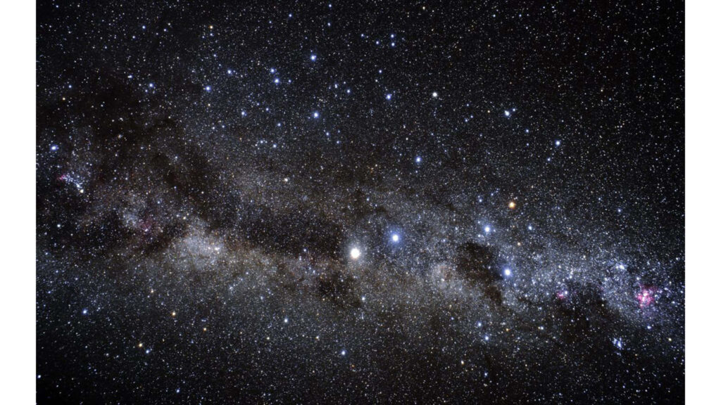Stunning starry cosmos wallpaper featuring a vibrant galaxy and countless celestial wonders.