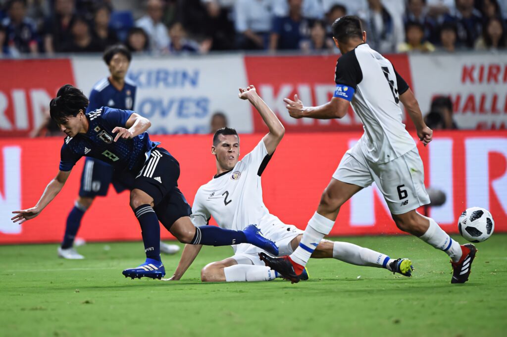 Costa Rica National Football Team versus Japan intense match action vivid stadium wallpaper background