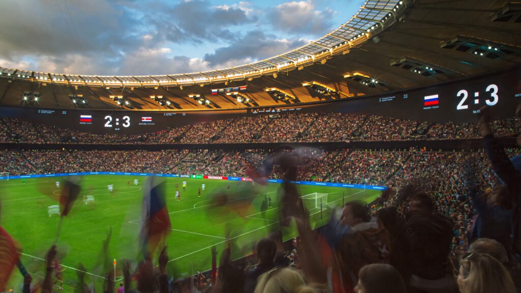 Costa Rica vs Russia football match intense stadium crowd bright lights dynamic player action Wallpaper
