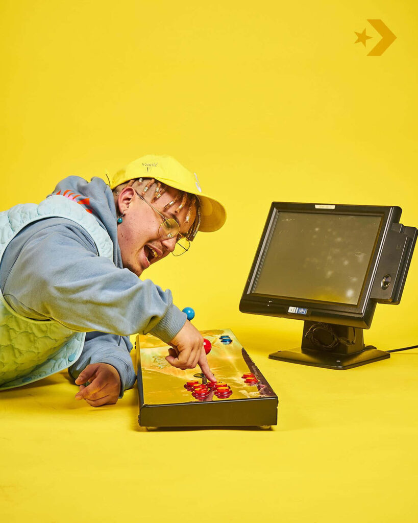 Costa Titch vibrant wallpaper yellow background retro arcade joystick touchscreen monitor urban style