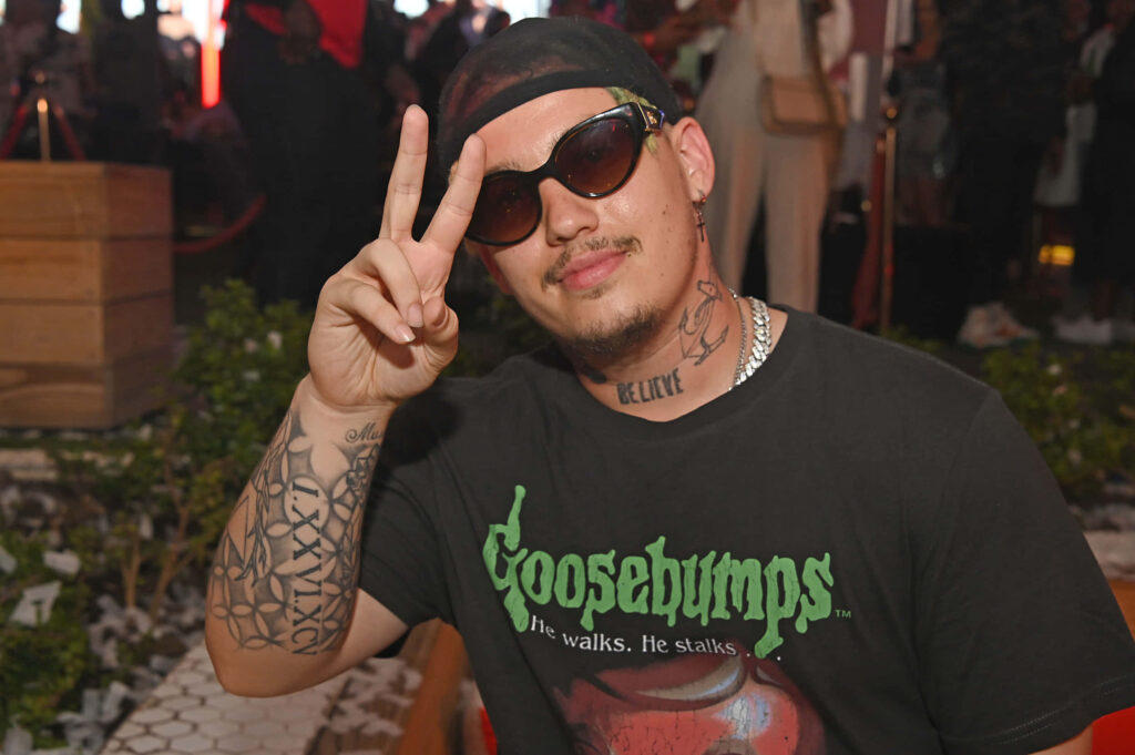 Costa Titch South African rapper wearing sunglasses black Goosebumps tee showing peace sign wallpaper