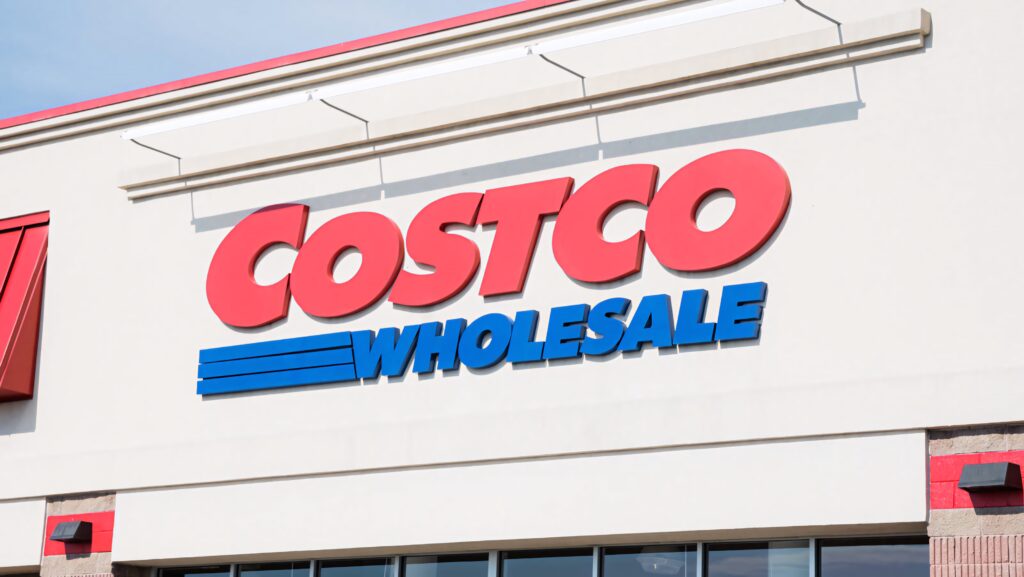 Costco Wholesale store facade with bold red and blue logo in bright daylight wallpaper background
