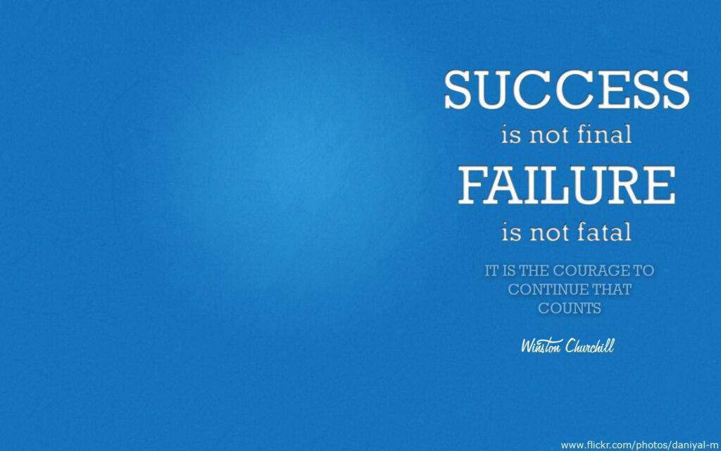 Courageous Persistence: Winston Churchill's Inspiring Message on a Serene Blue Desktop Background Wallpaper