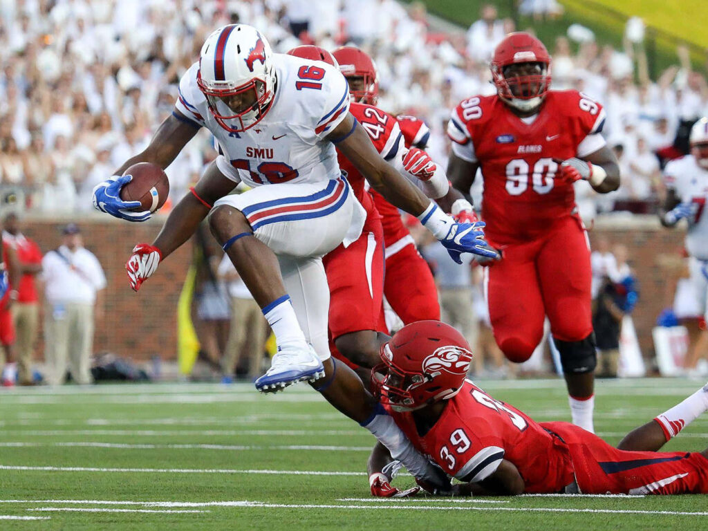 Courtland Sutton leaps to catch football over defender in SMU red white blue uniform stadium action Wallpaper
