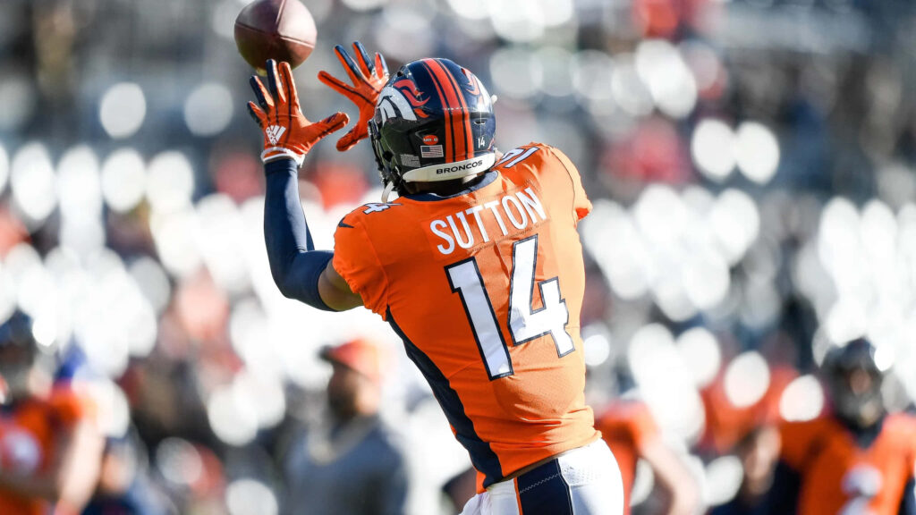 Courtland Sutton Denver Broncos catching football dynamic action stadium blurred background Wallpaper