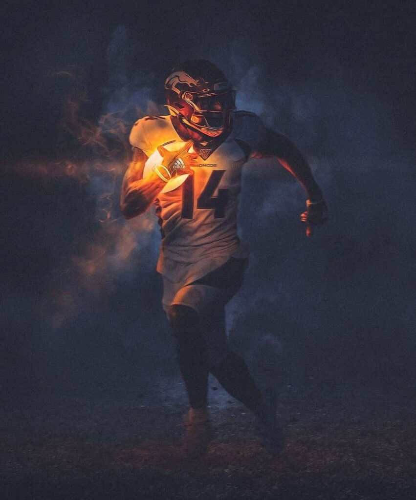 Courtland Sutton Denver Broncos powerful football wallpaper with smoke vivid orange accents shadows