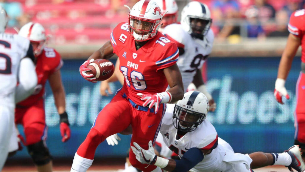 Courtland Sutton SMU football player evades defender in red white uniform on sunny field action Wallpaper