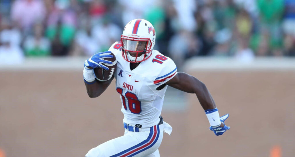 Courtland Sutton SMU football sprinting with ball in white red blue uniform dynamic game action Wallpaper