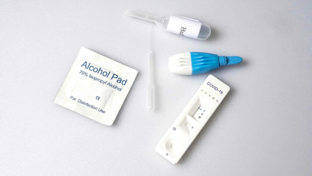 Essential Equipment Spread on a Clean Canvas: Ready for Covid Testing Wallpaper