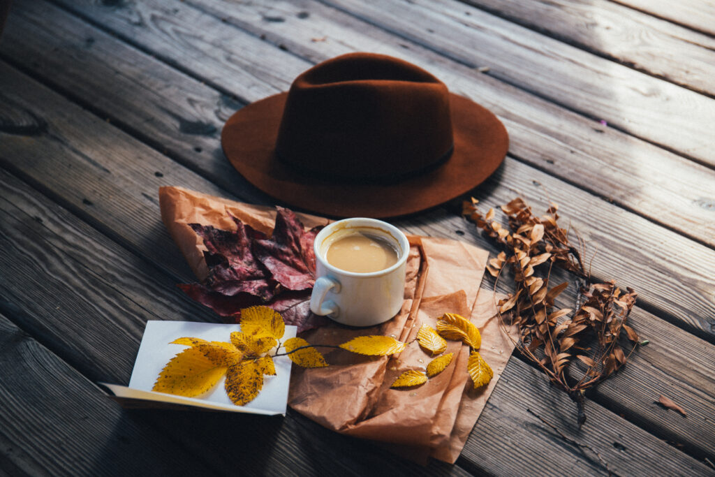 Cozy Autumn Wallpaper: Coffee, Leaves & Rustic Charm