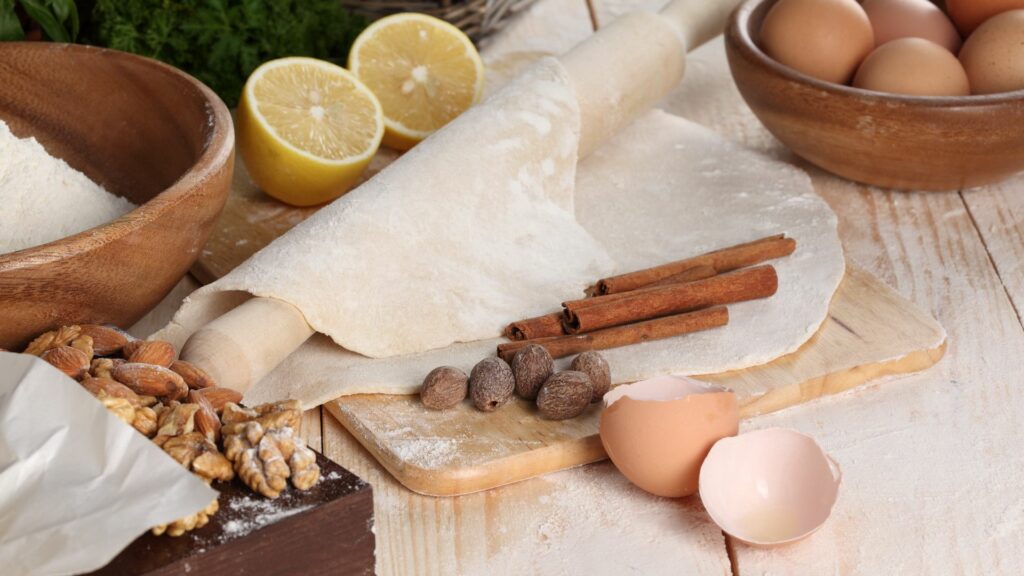 Cozy Baking-Themed Wallpaper: Rustic Kitchen with Eggs & Flour