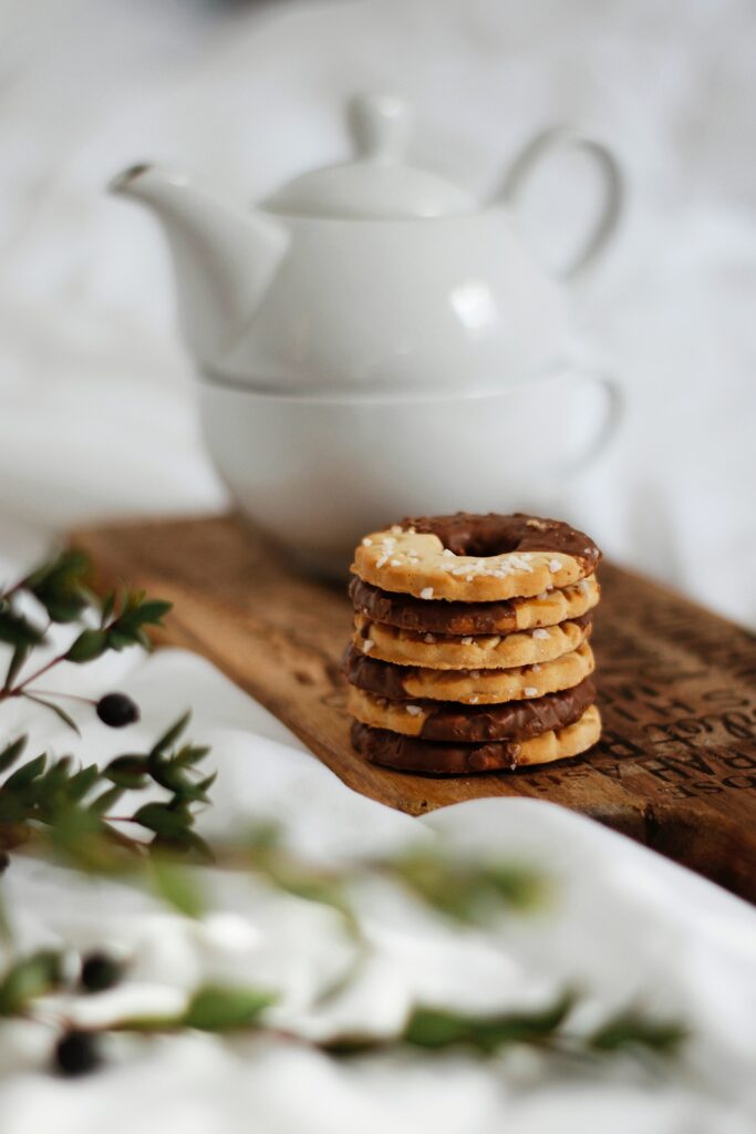 Cozy Biscuit Stack with Teapot: Rustic Wallpaper Background