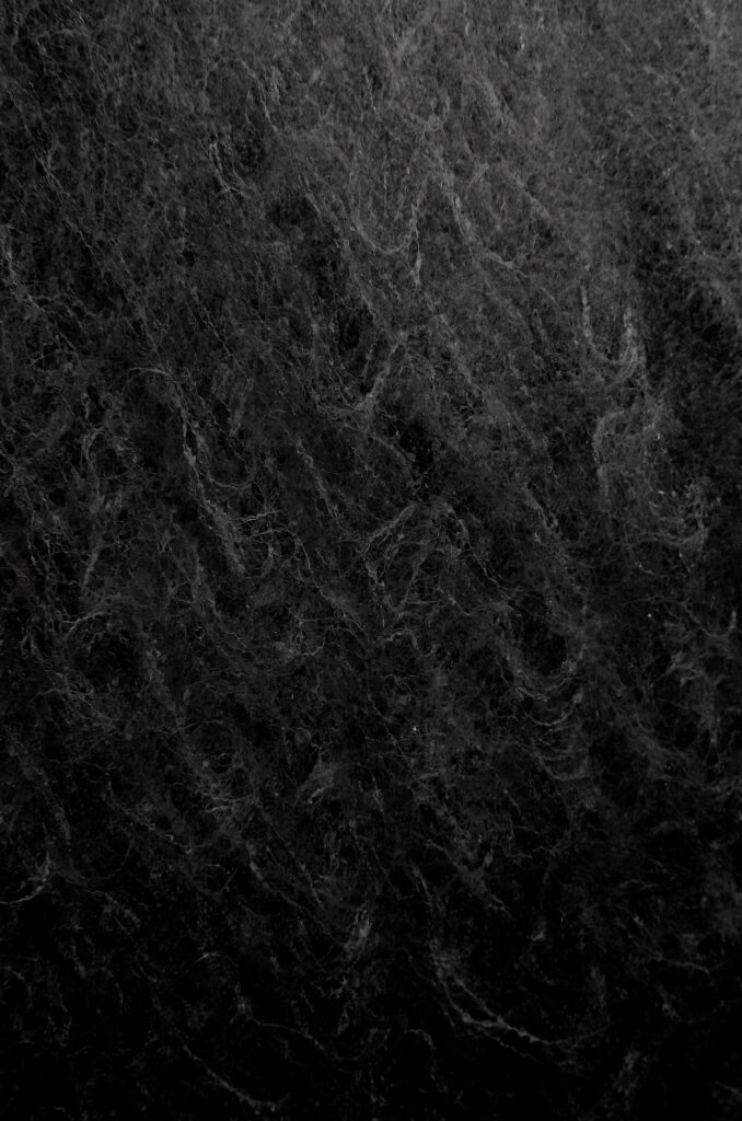 Cozy Black Wool Texture Wallpaper: Intricate Wavy Patterns Background