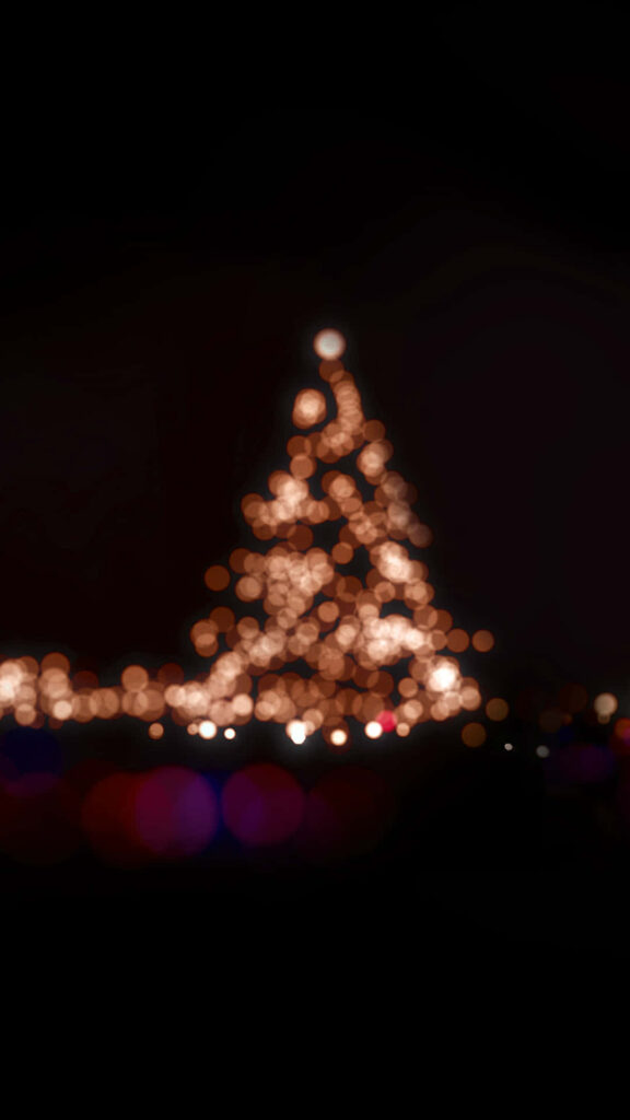Cozy Blurred Christmas Tree Wallpaper for iPhone - Festive Background
