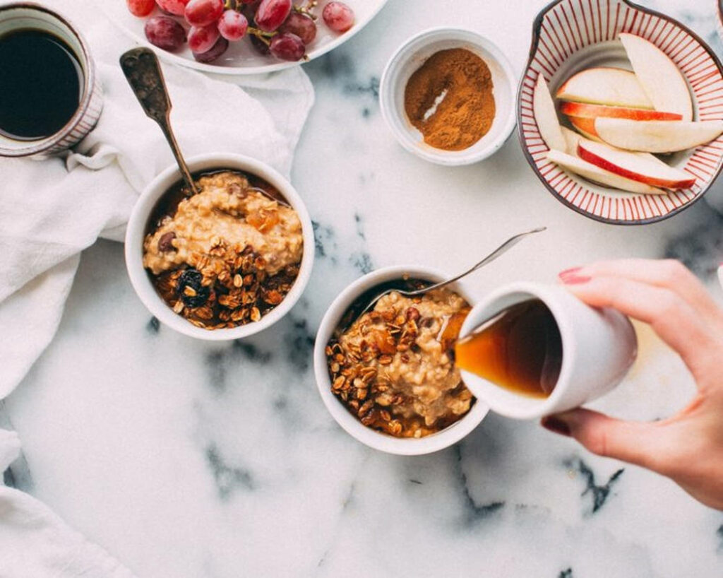 Cozy Breakfast Wallpaper: Oatmeal, Fresh Fruits & Syrup on Marble