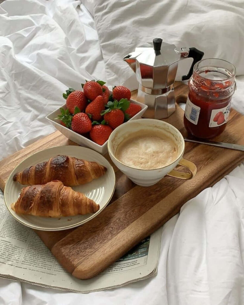 Cozy Breakfast: Croissants, Coffee, Strawberries & Stovetop Charm Wallpaper