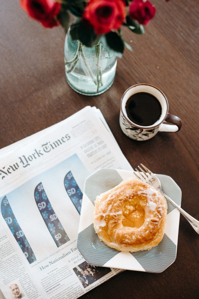 Cozy Breakfast Setup: Glazed Pastry, Coffee & Roses Wallpaper