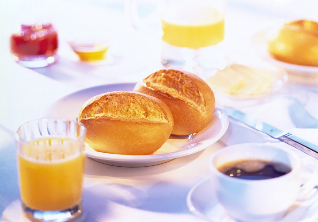 “Cozy Breakfast Wallpaper: Fresh Muffins, Coffee & Orange Juice”