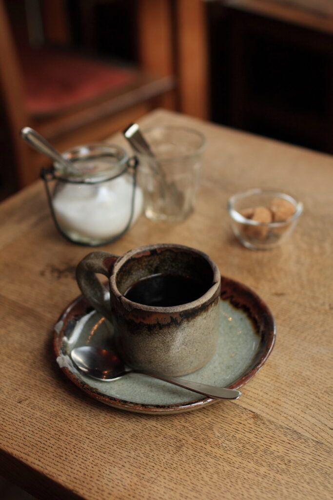Cozy Ceramic Coffee Mug Scene with Rustic Charm | Warm Wallpaper