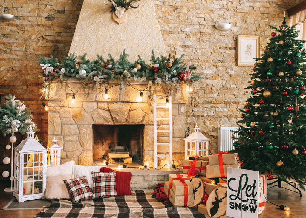 Cozy living room with decorated Christmas tree wrapped gifts rustic stone fireplace festive decor Wallpaper