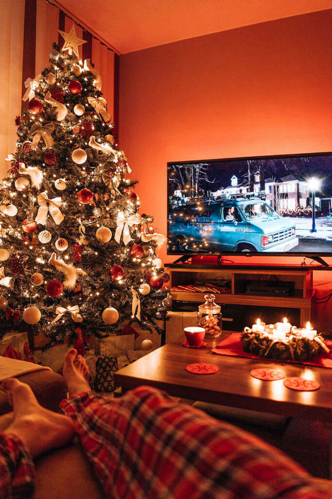 Christmas Cozy: Decorated Tree & Festive Living Room Ambiance Wallpaper