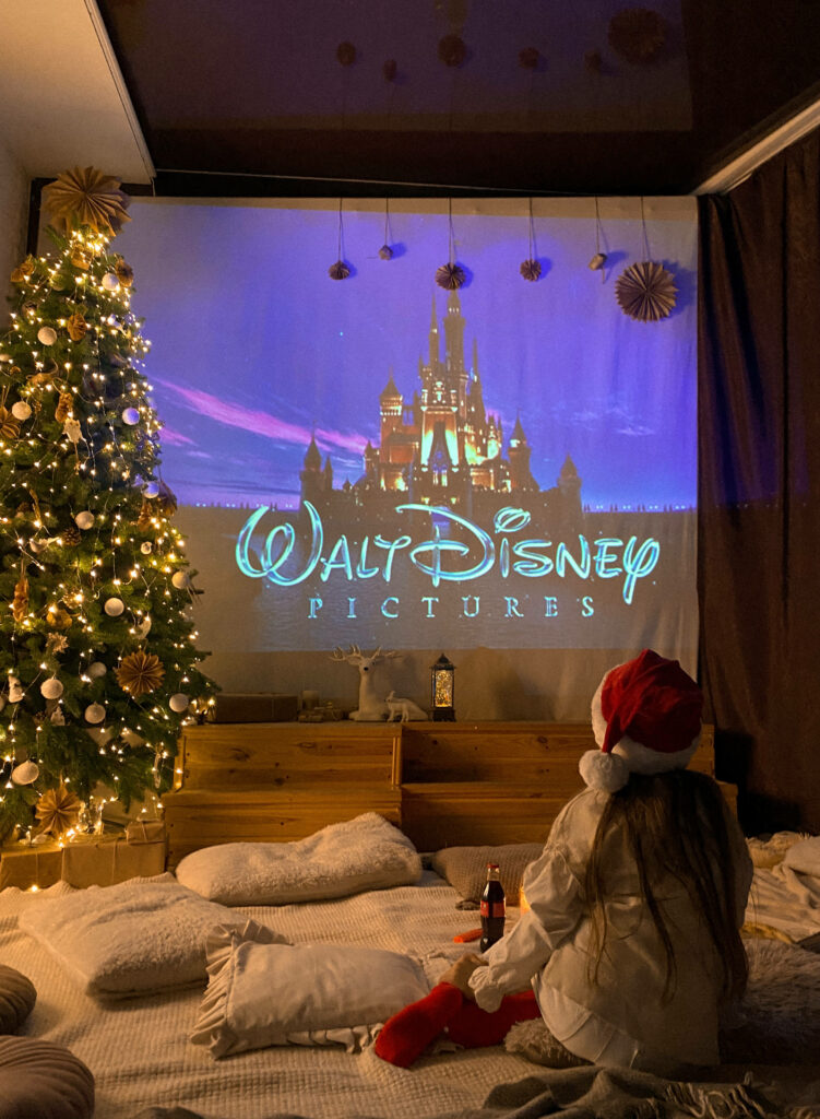 Cozy Christmas Movie Night: Festive Indoor Setting & Disney Magic Wallpaper
