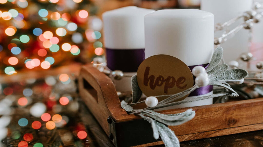 Cozy Christmas Scene: Festive Candles & Rustic Decorations Wallpaper
