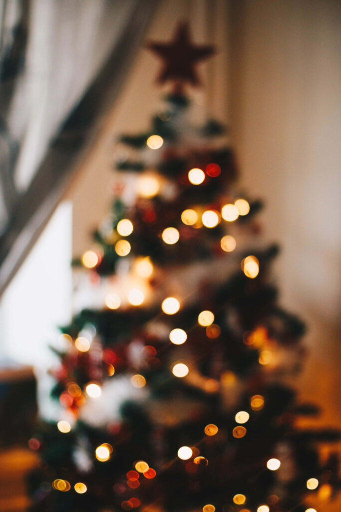 Cozy Blurred Christmas Tree Wallpaper with Twinkling Lights
