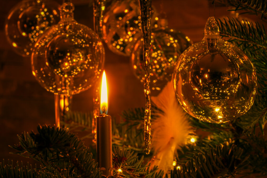 Cozy Christmas Wallpaper: Candlelit Scene with Shimmering Decor