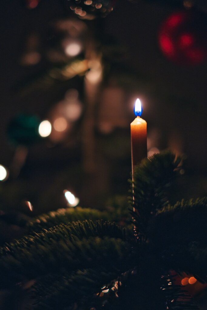 Warm Christmas Tree Candle Wallpaper - Festive Background Design
