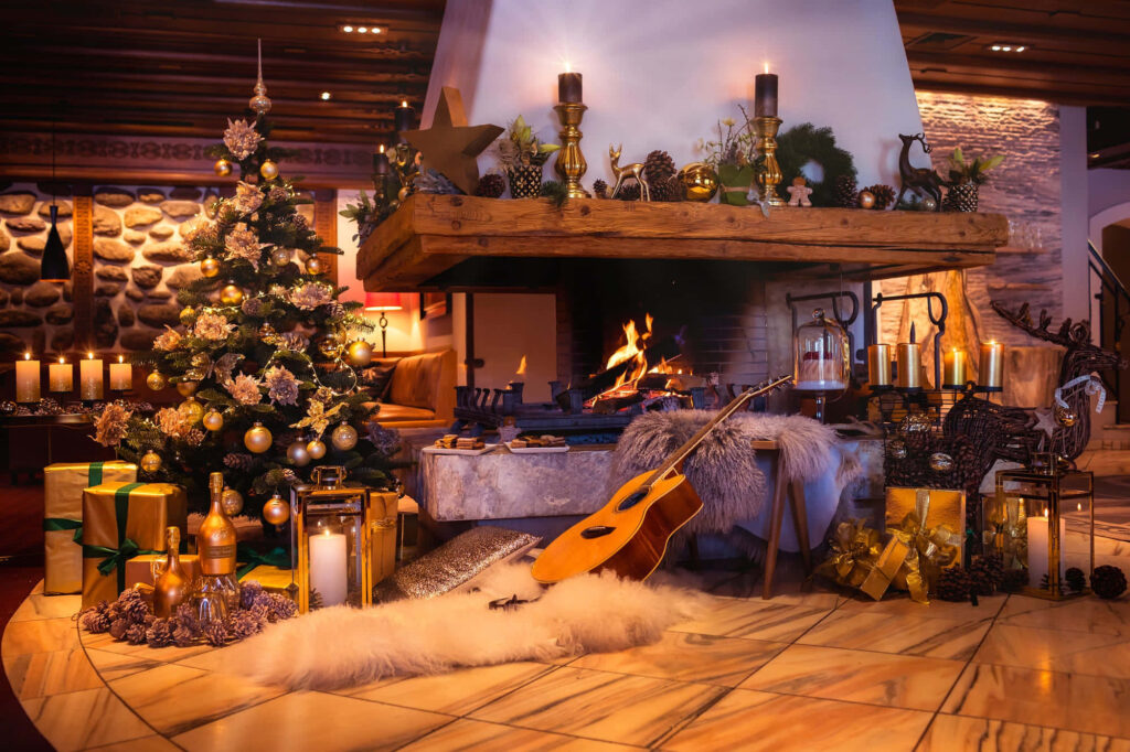 Cozy Christmas Fireplace Scene Wallpaper with Tree & Gifts