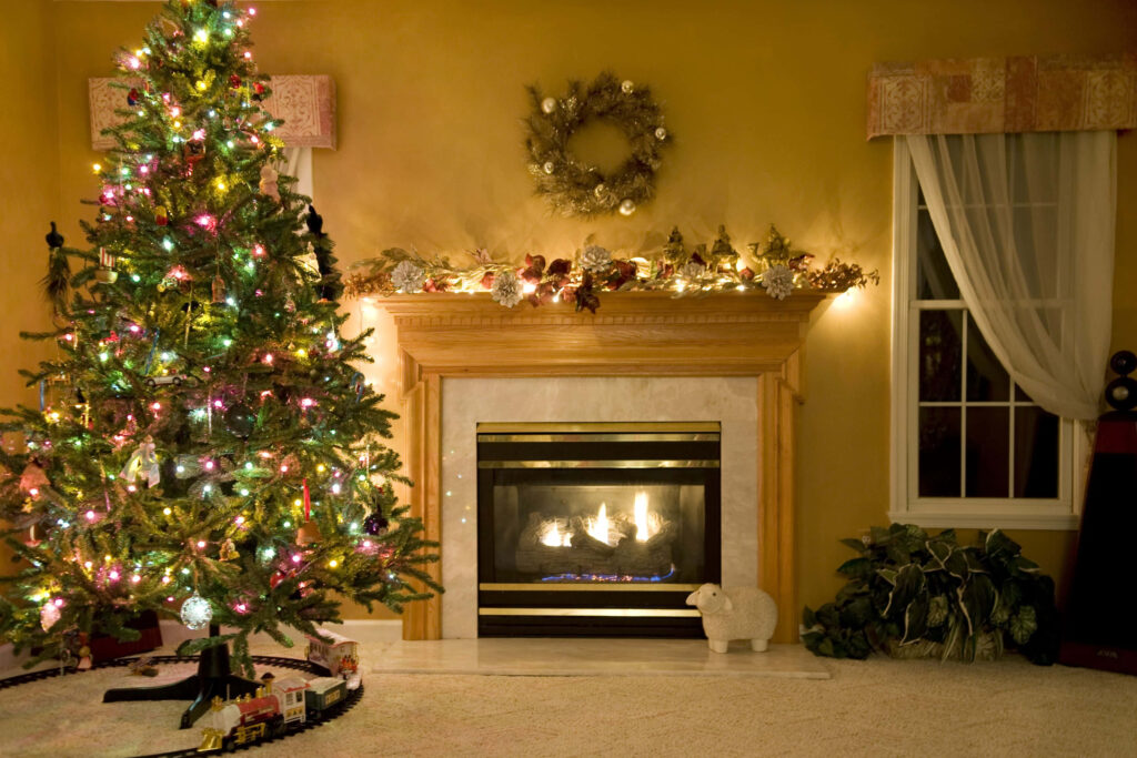 Cozy Christmas Wallpaper: Festive Room with Tree & Fireplace