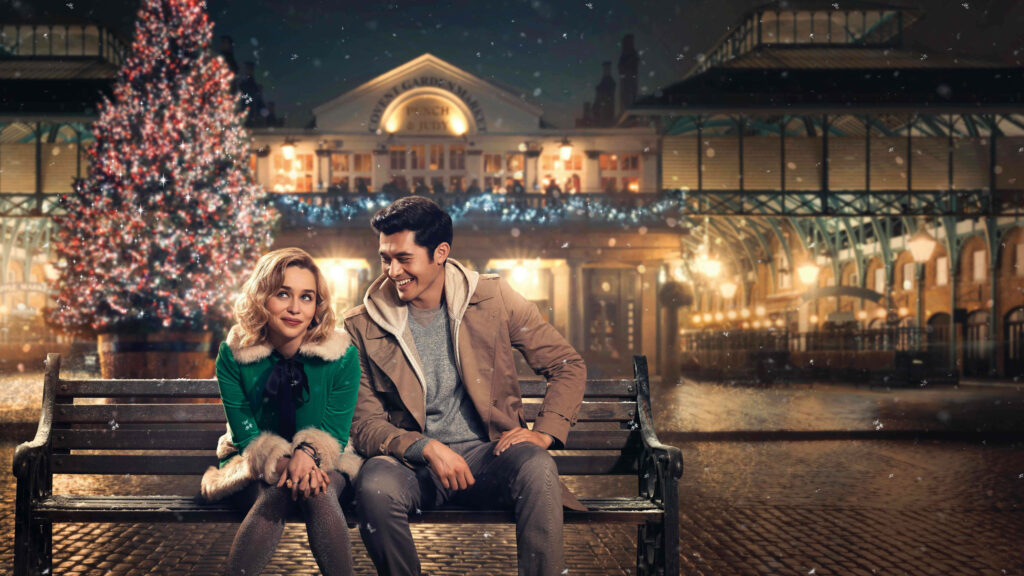 Cozy Christmas Wallpaper: Festive Tree & Charming Couple Scene