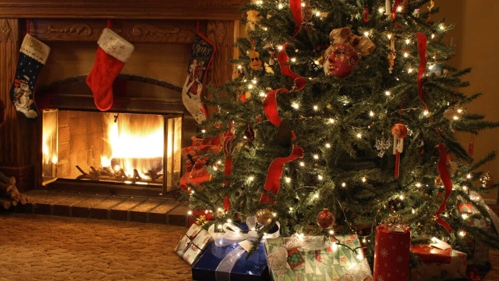 Cozy Christmas Wallpaper: Festive Tree & Warm Fireplace Scene