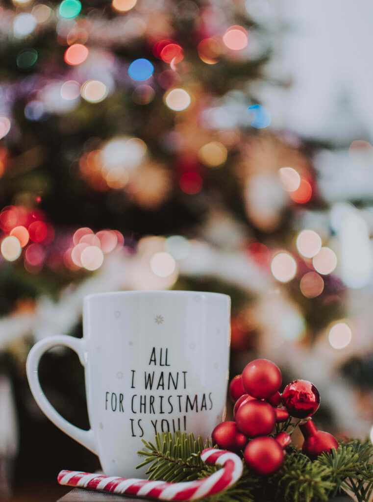 Cozy Christmas Wallpaper: Mug & Tree with Holiday Cheer