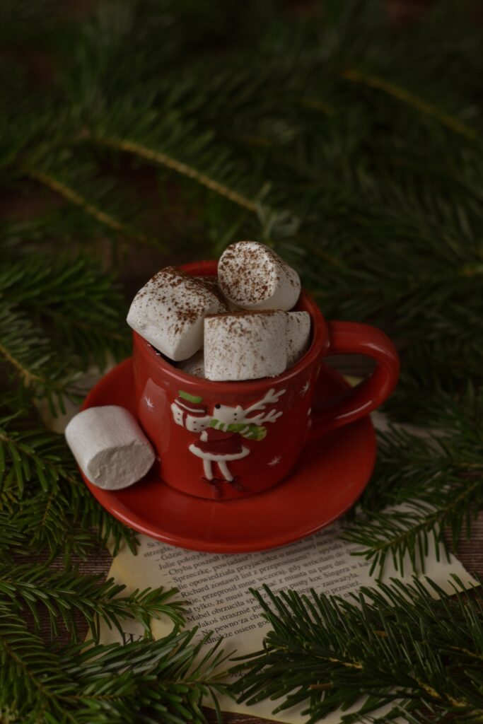 Cozy Christmas Wallpaper: Red Mug with Marshmallows & Spruce Branches