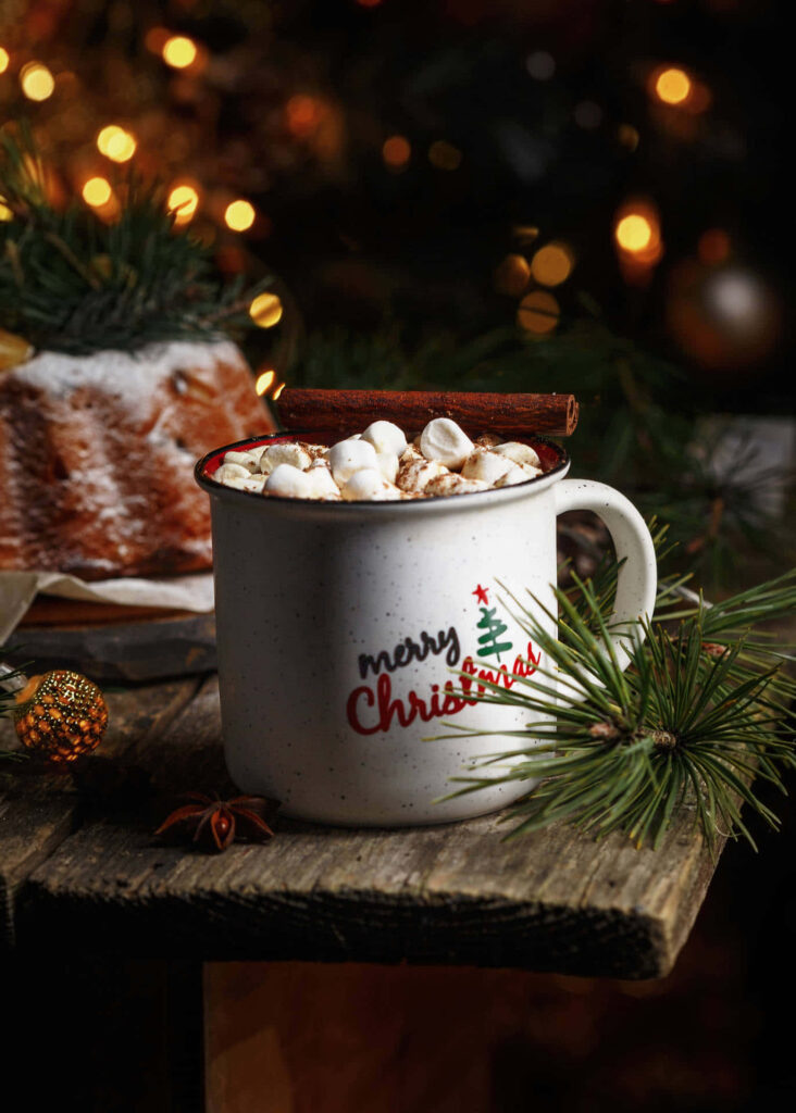 Cozy Christmas Wallpaper: Festive Mug & Pine Decor Background
