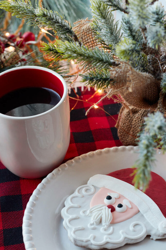 Cozy Christmas Wallpaper: Santa Gingerbread & Coffee on Plaid Table