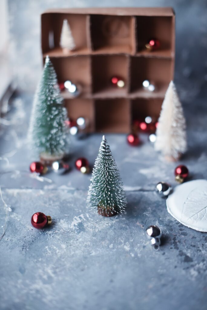 Cozy Christmas Wallpaper: Small Trees & Decorative Balls Background