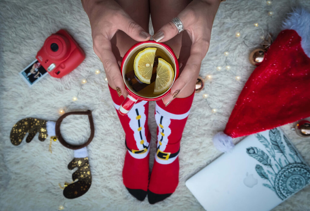 Cozy Holiday Wallpaper: Festive Tea Scene with Christmas Decor