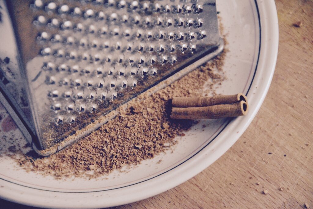 Cozy Rustic Wallpaper: Cinnamon Sticks & Grater Charm