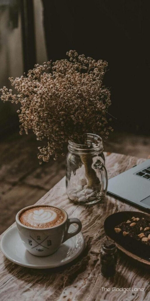 Cozy Coffee Aesthetic Wallpaper: Warm Cup & Rustic Floral Charm